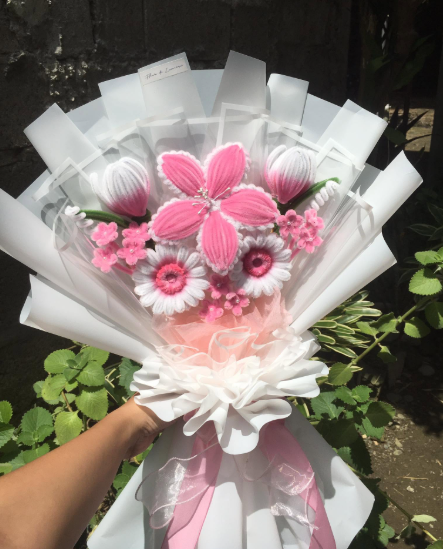 Blushing Garden bouquet — soft pink blooms wrapped in white paper